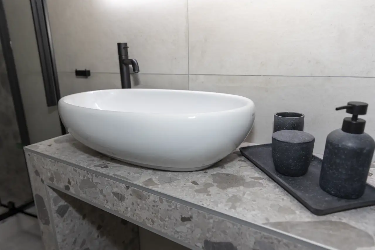 Terrazzo vanity with stone basin